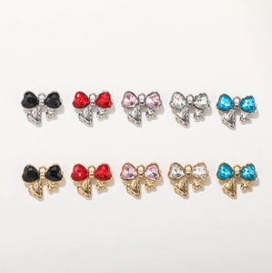 Bow tie heart charms with colorful crystals in gold and silver base settings for DIY jewelry