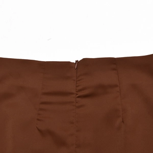 Close-up of the brown high-waisted skirt showing the invisible back zipper and smooth fabric