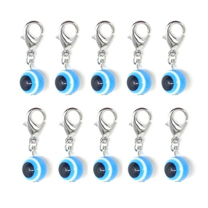 Detailed view of ten blue resin evil eye charms with silver lobster clasps for DIY jewelry