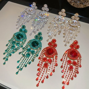 Macro shot of French geometric tassel earrings set with diamonds in four elegant colors