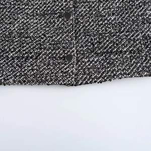 Women's black and white sequined tweed jacket with textured knit and polished buttons
