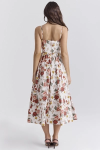 Detail view of the back cut-out and waist design on this floral midi summer sundress