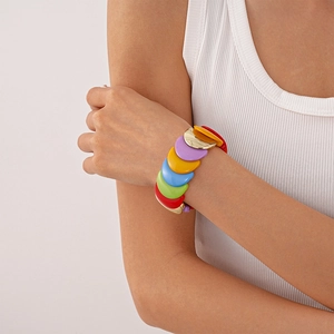 Close-up of colorful acrylic dopamine bracelet with vibrant resin segments and gold link