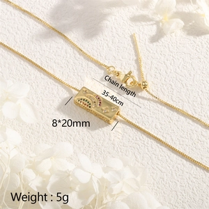 Detail view of gold rectangle moon star pendant with color zircon and size parameters