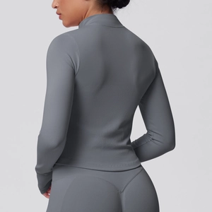 Detail view of grey high-stretch seamless yoga set with vertical texture and slim fit