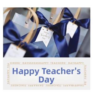 Detail of frosted gift bag with blue ribbon bow and Happy Teacher's Day tag