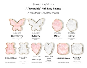 Detail view of assorted resin nail art palettes with gold trim and butterfly heart shapes