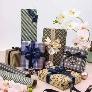 Blue plaid and vintage kraft gift wrapping paper rolls with festive ribboned gift boxes