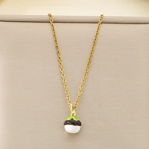 Close-up of a stainless steel gold necklace featuring a cute chestnut fruit pendant