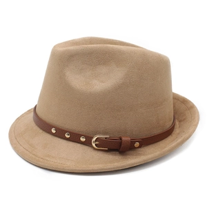 Detail of camel suede fedora featuring a brown leather band with gold metal buckles