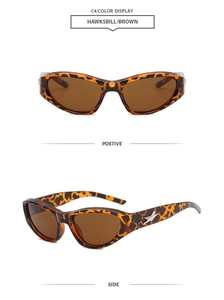 Detail view of tortoiseshell Y2K sunglasses with brown lenses and star metal accent