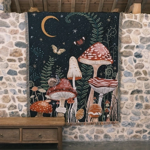 Bohemian mushroom tapestry with tassels hanging on a stone wall for room decor