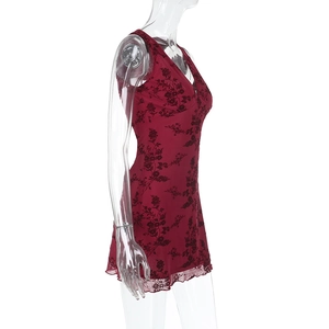 Detailed close-up of wine red floral sleeveless dress with V-neck and ruffle hem trim