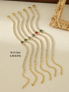 Detailed view of gold tennis bracelets with vibrant colorful zircon stones and length guide
