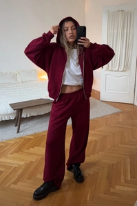Burgundy knit cotton hoodie set with zip-up jacket and wide-leg sweatpants on a model