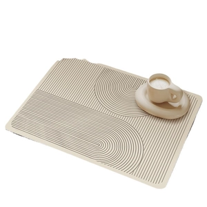 Minimalist beige kitchen drying mat with geometric lines on a clean white surface