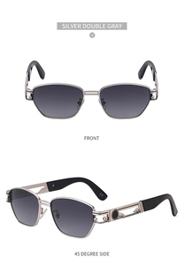 Macro detail of silver steampunk sunglasses with grey lenses and ornate metal hinges