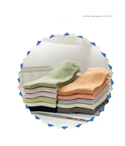 Detailed stack of multi-colored cotton crew socks showing various vibrant pastel tones