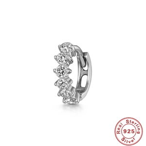 Macro view showing detailed prong-set white cubic zirconia on a 925 sterling silver hoop earring