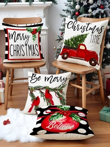 Close-up of four Christmas linen pillowcases with red truck prints in a cozy home setting