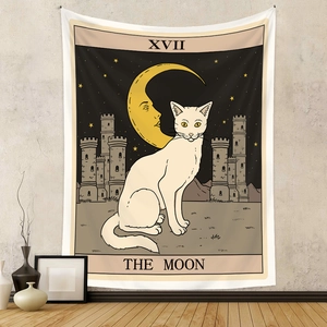 Detail of tarot moon cat tapestry with XVII The Moon print hanging on a beige wall