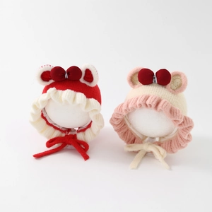 Infant knitted hat with lace edges, cute ears, and a bow tie for baby girls
