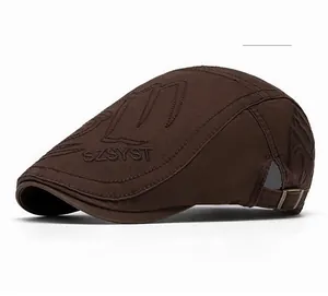 Detail of coffee duckbill cap showing embroidery and adjustable metal buckle strap