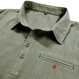 Close-up of olive green cotton linen shirt with wood buttons and pocket detail