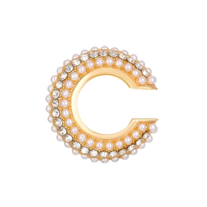 Close-up of C-shaped ear cuff featuring elegant pearls and sparkling rhinestones