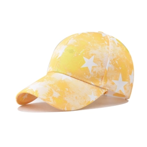 Detail of yellow tie-dye cotton baseball cap with white star patterns and street style