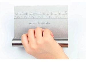 Close-up of stainless steel dough scraper featuring precision dual scales and a round handle