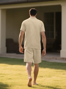 Outdoor shot showing back view of men's apricot button-down shirt and shorts set