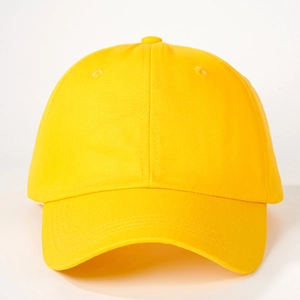 Detailed macro view of yellow cotton twill baseball cap fabric and stitched eyelets