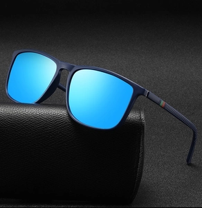 Detail of square polarized sunglasses with blue mirrored lenses and striped temple arms
