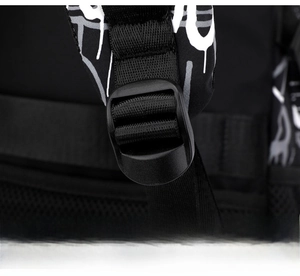 Detail of adjustable strap buckle on high-capacity backpack with graffiti pattern