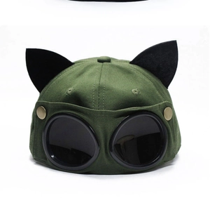 Detail of army green aviator baseball cap featuring decorative black cat ears and goggles