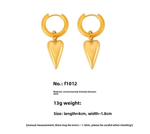 Detailed view of gold plated titanium steel heart earrings with hoop closures