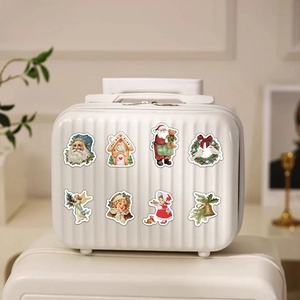 Retro Christmas stickers set on white suitcase for festive holiday gift decoration
