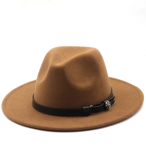 Detailed macro shot of a brown wool fedora hat featuring a black band with a floral silver buckle