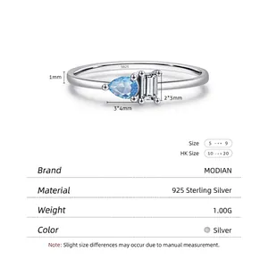 925 sterling silver ring with pear-cut light blue stone and rectangular clear gem