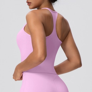 Close-up of pink racerback yoga top showing elastic fabric and body-hugging fit
