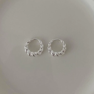 Minimalist S925 sterling silver hoop earrings with spiral twist texture on a tray