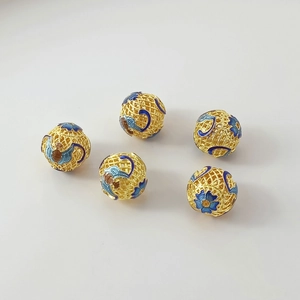 Detailed view of handmade 18K gold-plated cloisonne enamel hollow beads for DIY jewelry