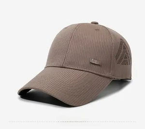 Detail view of breathable side vents and metal sports tag on brown mesh baseball cap
