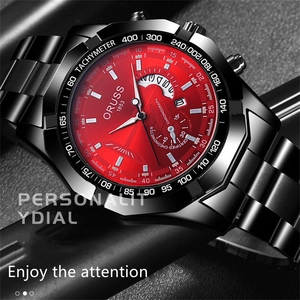 Macro shot of ORUSS men's watch featuring a red dial and black stainless steel band
