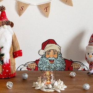 Detail of Santa Claus peeking wall sticker on white background with festive Christmas decor