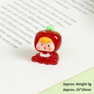 Miniature luminous resin apple doll on vintage book showing dimensions 16x20mm and 3g weight