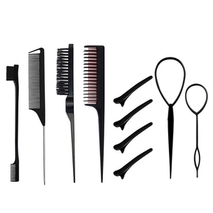 Professional black hair styling tool set with combs and clips on a white background