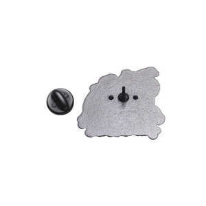 Detail view of the metal brooch back with sandblasted texture and black rubber clutch