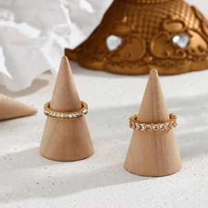 Detail of 18K gold plated stainless steel rings with round and square cubic zirconia